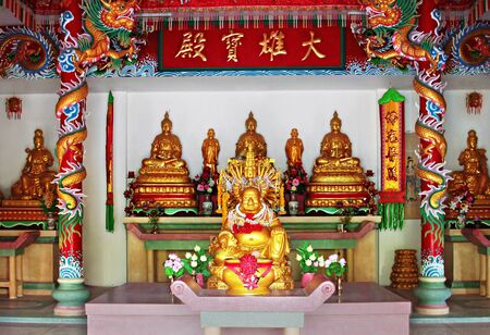 KOH-PHANGAN, THAILAND - JANUARY 18: Buddha in Kuan Yin temple on January 18, 2011, Koh-Phangan island, Thailand. Kuan Yin temple is the main buddhist temple and meditation center on Koh Phanganのeditorial素材
