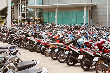 PHUKET, THAILAND - NOVEMBER 20: Many motorbikikes at the parking near big store on November, 20, 2010, Phuket, Thailand. Motorbike is a most popular transport in Thailand.のeditorial素材