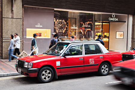HONG KONG - MARCH 19: Taxis on the street on March 19, 2013 in Hong Kong. Over 90% daily travelers use public transport. Its the highest rank in the world.のeditorial素材