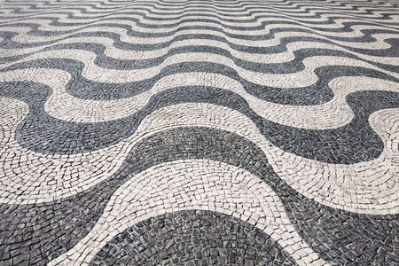 Waves of tiled floor in portuguese traditional style, Rossio square, Lisbon
