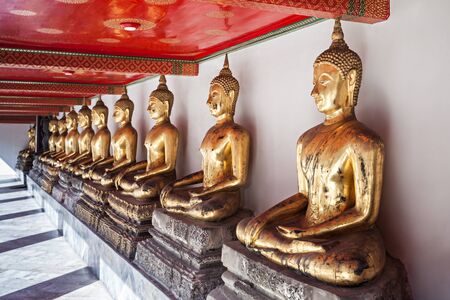 Golden Buddha statues in Wat Pho Temple - Buddhist temple complex in Bangkok, Thailand