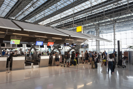 BANGKOK, THAILAND - OCTOBER 15, 2014: Check in desk in Suvarnabhumi Airport. It is one of two international airports serving Bangkok, Thailand.のeditorial素材