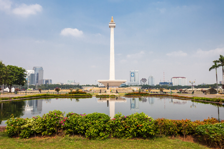 JAKARTA, INDONESIA - OCTOBER 21, 2014: The National Monument is a 132m tower in the centre of Merdeka Square, Jakarta, symbolizing the fight 
for Indonesia.のeditorial素材