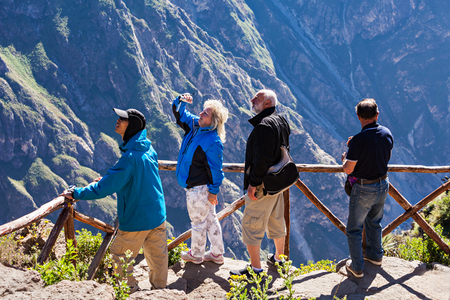 CABANACONDE, PERU - MAY 13, 2015: Unidentified tourists at the Cruz Del Condor viewpoint.のeditorial素材