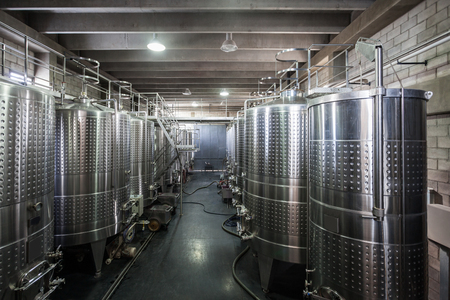 Wine Fermenting process in stainless steel vats in a wine cellarのeditorial素材