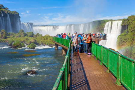 IGUAZU, ARGENTINA - MAY 02, 2016: Unidentified tourists at the Iguazu Falls. It's one of the New 7 Wonders of Nature, located on the border of Brazil and Argentina.のeditorial素材