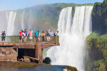 IGUAZU, ARGENTINA - MAY 02, 2016: Unidentified tourists at the Iguazu Falls. It's one of the New 7 Wonders of Nature, located on the border of Brazil and Argentina.のeditorial素材