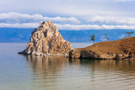 Shamanka (Shamans Rock) on Baikal lake near Khuzhir at Olkhon island in Siberia, Russia. Lake Baikal is the largest freshwater lake in the world.の写真素材