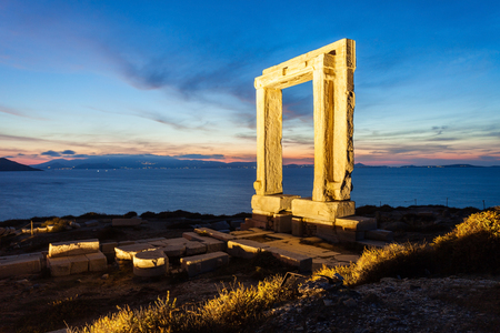 Naxos Portara or Apollo Temple entrance gate on Palatia island near Naxos island in Greece at nightの写真素材