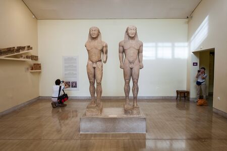 DELPHI, GREECE - OCTOBER 15, 2016: The twin statues by Polymedes of Argos or  Kleobis and Biton at Delphi Archaeological Museum. Delphi was an important ancient Greek religious sanctuary.のeditorial素材