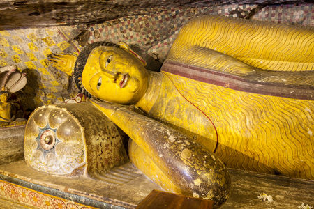 DAMBULLA, SRI LANKA - FEBRUARY 17, 2017: Sculpture of reclining Buddha inside Dambulla Cave Temple. Cave Temple is a World Heritage Site near Dambulla city in Sri Lanka.のeditorial素材