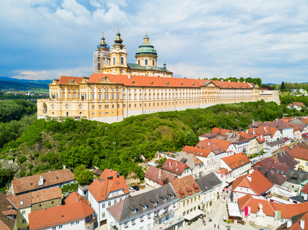 Melk Abbey Monastery aerial panoramic view. Stift Melk is a Benedictine abbey in Melk, Austria. Monastery located on a rocky outcrop overlooking the Danube river and Wachau valley.の写真素材