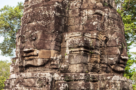 Stone Faces at Bayon Temple. Bayon is a well known khmer temple at Angkor in Cambodia.の写真素材
