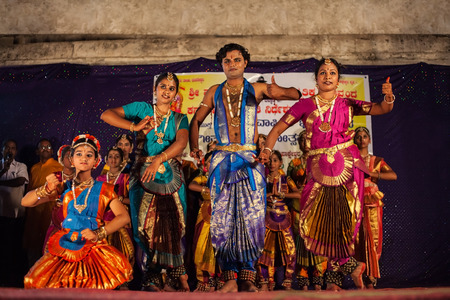 HAMPI, INDIA - FEBRUARY 20, 2012: Unidentified artists performing traditional indian dance in Hampi in India at Holi festivalのeditorial素材