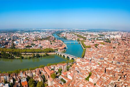 Toulouse and Garonne river aerial panoramic view. Toulouse is the capital of Haute Garonne department and Occitanie region in France.の写真素材