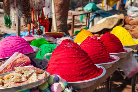 Plates with holi powder colors at the local market in Indiaの写真素材