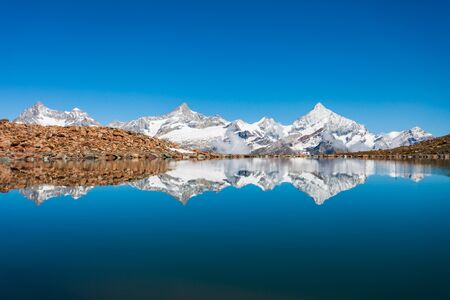 Riffelsee lake and Matterhorn mountain in the Alps, located between Switzerland and Italyの写真素材