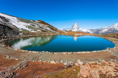 Riffelsee lake and Matterhorn mountain in the Alps, located between Switzerland and Italyの写真素材