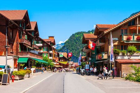 LAUTERBRUNNEN, SWITZERLAND - JULY 14, 2019: Traditional local houses in Lauterbrunnen village in the Interlaken district in the Bern canton of Switzerlandのeditorial素材