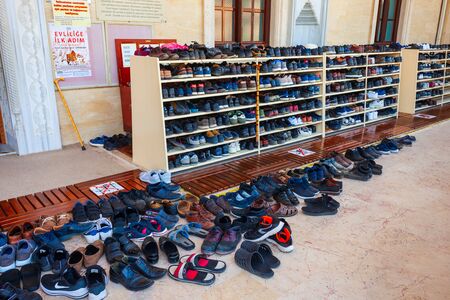 MANAVGAT, TURKEY - NOVEMBER 08, 2019: A lot of shoes at the Central Mosque mosque entranceのeditorial素材
