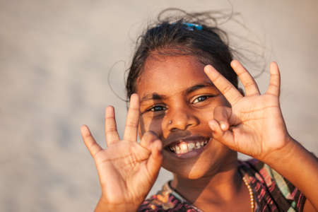 GOA, INDIA - NOVEMBER 08, 2011: Unidentified indian girl posing at the beach in Goa in India