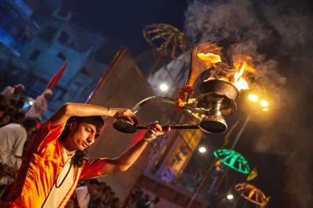 VARANASI, INDIA - APRIL 11, 2012: Ganga Aarti is a ceremony performed to honor the River Goddess Ganga at Dashaswamedh Ghat in Varanasi, Indiaのeditorial素材