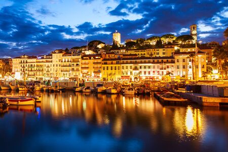 Cannes portl panoramic view at night. Cannes is a city located on the French Riviera or Cote d'Azur in France.の写真素材