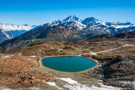 Riffelsee lake and Matterhorn mountain in the Alps, located between Switzerland and Italyの写真素材