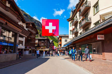 ZERMATT, SWITZERLAND - JULY 15, 2019: Traditional local houses in the centre of Zermatt town in the Valais canton of Switzerlandのeditorial素材