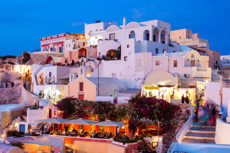 Oia on sunset. Oia or Ia is a small town in the South Aegean on the islands of Santorini in the Cyclades, Greeceの写真素材