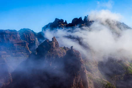 Pico do Arieiro to Pico Ruivo trek mysty landscape in Madeira island, Portugal