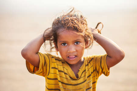 GOA, INDIA - NOVEMBER 08, 2011: Unidentified indian girl posing at the beach in Goa in Indiaのeditorial素材