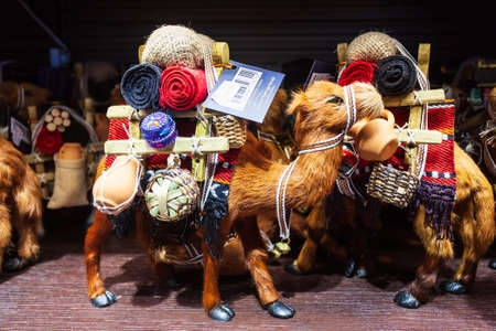 DUBAI, UAE - MARCH 02, 2019: Camel toy souvenir in the duty free zone in the Dubai International...