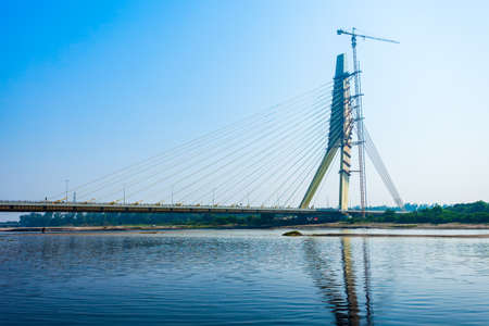 NEW DELHI, INDIA - OCTOBER 06, 2019: Signature Bridge is a cantilever spar cable stayed bridge through the Yamuna river in New Delhi, Indiaのeditorial素材