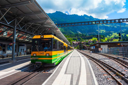 WENGEN, SWITZERLAND - JULY 14, 2019: Train at the Wengen railway station in the Interlaken district, Bern canton in Switzerlandのeditorial素材