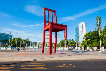 GENEVA, SWITZERLAND - JULY 20, 2019: Broken Chair or Chaise Cassee is a wooden sculpture by the Swiss artist Daniel Berset and Louis Geneve in Geneva city in Switzerlandのeditorial素材