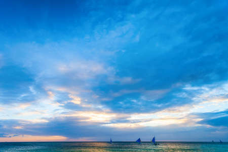 Dramatic tropical sunset at Boracay island beach in Philippines