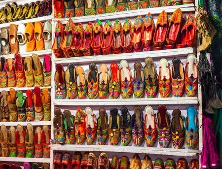 Traditional indian shoes at the Arpora night market in Goa state of Indiaの写真素材