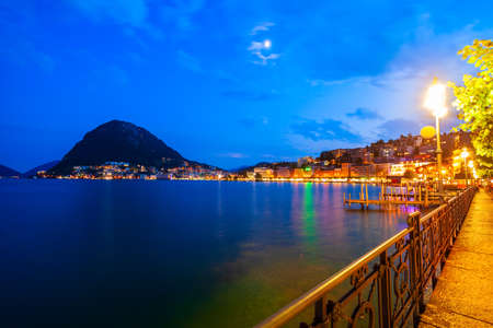 Lugano lake and Lugano city panoramic view in canton of Ticino in Switzerlandの写真素材