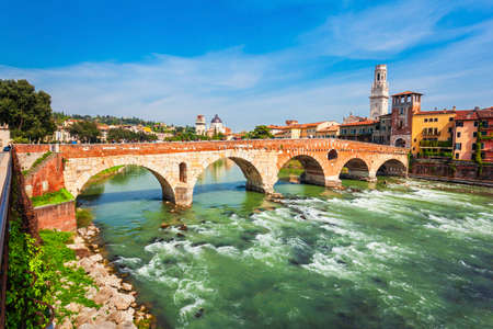 Ponte Pietra bridge is a Roman arch stone bridge crossing the Adige River in Verona, Veneto region in Italyの写真素材