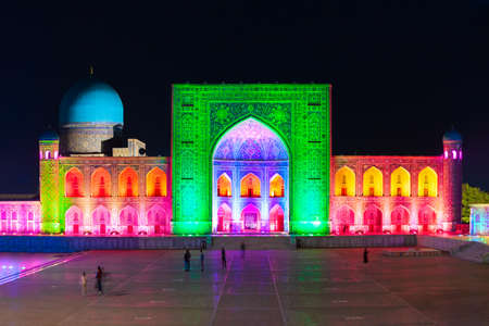 Registan Tilya Kori Madrassah night laser show. Registan is an ancient city in Samarkand city in Uzbekistan.の写真素材