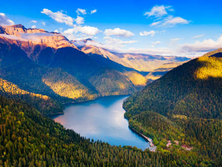 Lake Ritsa aerial panoramic view at sunset. Lake Ritsa is a lake in the Caucasus Mountains in...