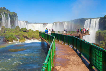 IGUAZU, ARGENTINA - MAY 02, 2016: Unidentified tourists at the Iguazu Falls. It's one of the New 7 Wonders of Nature, located on the border of Brazil and Argentina.のeditorial素材