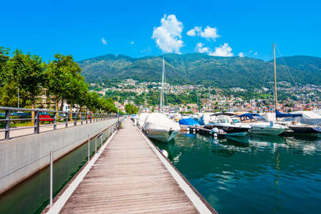 Locarno port with yachts and boats. Locarno is a town located on Lake Maggiore in Ticino canton of Switzerland.の写真素材