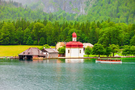 St. Bartholomew or St. Bartholomae is a roman catholic church at the Konigssee Lake in Bavaria, Germanyの写真素材