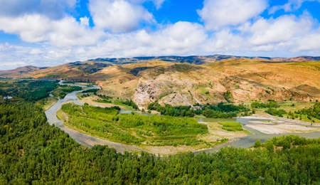 Uplistsikhe aerial panoramic view. Uplistsikhe is an ancient rock hewn town near Gori in Shida...