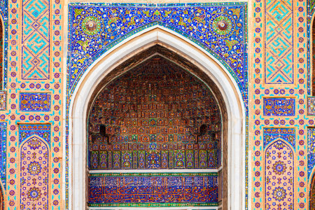 Registan mosaic pattern design background of ceramic tiles of Registan madrasah in Samarkand city, Uzbekistanの写真素材