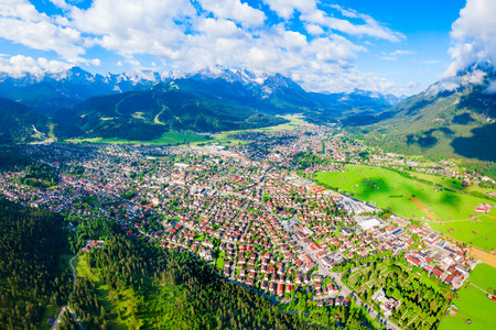 Garmisch-partenkirchen and Zugspitze mountain aerial panoramic view. Garmisch Partenkirchen is an Alpine ski town in Bavaria, southern Germany.の写真素材