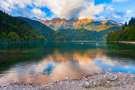 Lake Ritsa panoramic view at sunset. Lake Ritsa is a lake in the Caucasus Mountains in Abkhazia region, Georgia.の写真素材