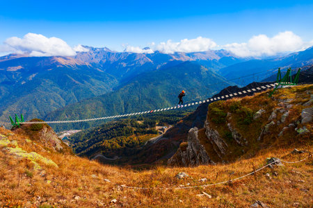 Suspension bridge at Rose Peak mountain station in Sochi resort city in Krasnodar Krai, Russiaの写真素材